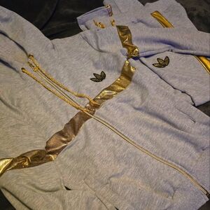 Grey with gold Adidas jumpsuit size large.